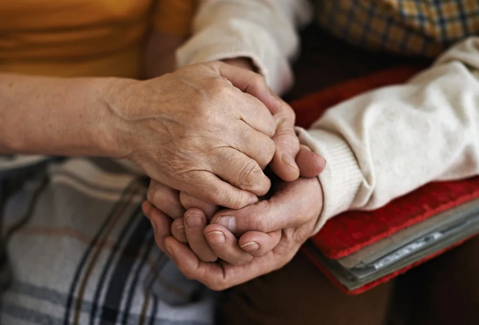 Patients holding hands